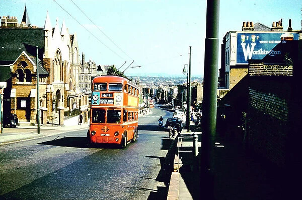 1960s climbing Highgate Hill, a trolleybus passes Despard Road
