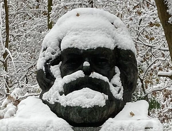 Grave of Karl Marx in the snow, Highgate Cemetery, London, 2022