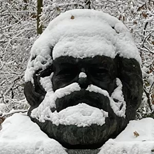 Grave of Karl Marx in the snow, Highgate Cemetery, London, 2022